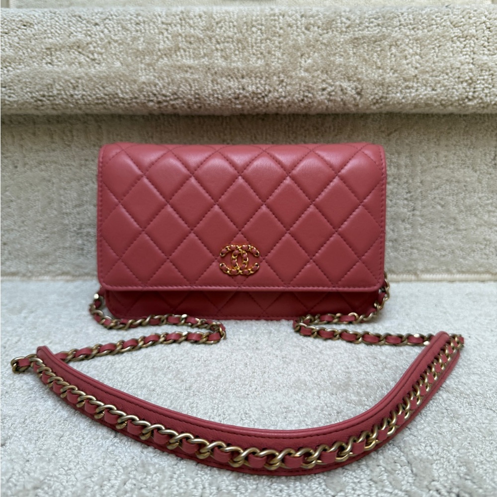 Authentic Chanel coral pink wallet on chain.